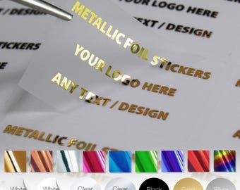 May include: Clear stickers with gold metallic foil text that reads "METALLIC FOIL STICKERS", "YOUR LOGO HERE", and "ANY TEXT/DESIGN". A pair of tweezers holds a sticker. Color options include white, clear, black, gold, and silver.