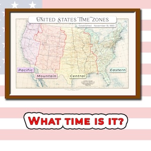 May include: A framed vintage map of the United States, highlighting time zones: Pacific, Mountain, Central, and Eastern. The map is labeled "United States Time Zones" and "Established November 18, 1883." Below the frame is a cartoon speech bubble that says "WHAT TIME IS IT?"