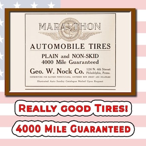 May include: Vintage framed advertisement for Marathon Automobile Tires. The ad features text that reads "Plain and Non-Skid 4000 Mile Guaranteed." The frame is brown, and the background is a patriotic design with red and white stripes and stars.