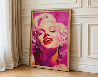 May include: A framed portrait of Marilyn Monroe in a vibrant pink and orange colour palette. The artwork shows a close-up of Monroe's face, with her signature red lipstick and platinum blonde hair. The frame is gold, and the artwork is leaning against a wall.