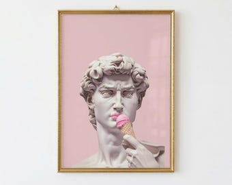May include: A framed art print showing a classical sculpture with pink lipstick and an ice cream cone. The artwork is set against a pink backdrop and framed in gold, offering a contemporary take on classic art.