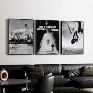 May include: A triptych of framed black and white prints. The left print shows a skier on a snowy mountain. The center print has the text "PAIN IS TEMPORARY. QUITTING LASTS FOREVER." The right print depicts a person on a bicycle.
