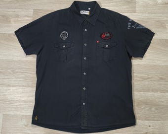 Camisa Quiksilver Vintage 90s Y2K negra lavada • Ropa de surf, skate y streetwear • Logotipo bordado • Corte holgado XL
