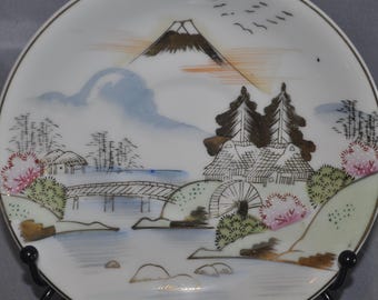 Hand-painted Kutani Japanese porcelain decorative plate