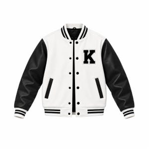 May include: A varsity jacket featuring a white body with black sleeves, a black letter K patch on the left chest, and black snap buttons. The collar, cuffs, and hem are ribbed with black and white stripes, and the jacket has two side pockets.