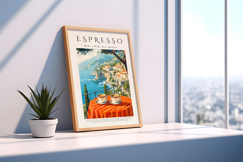 May include: A framed art print with the word "ESPRESSO" at the top. The print shows an Italian coastal scene with a table set for two, with espresso cups. The table is covered with an orange tablecloth.