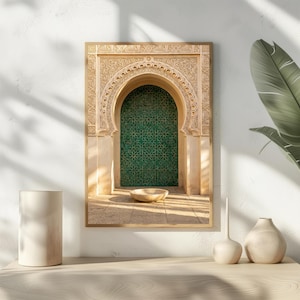 May include: A framed print of an arched doorway with intricate carvings and a green tiled door. The doorway is framed in beige stone, and a small bowl sits in front of the door. The image evokes a sense of Middle Eastern architecture.