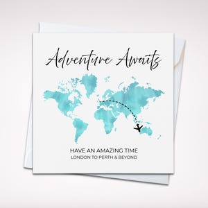 May include: A white greeting card with the words "Adventure Awaits" in black script. It features a teal watercolor world map, a dotted line, and an airplane graphic. The text at the bottom reads "Have an amazing time London to Perth & Beyond."