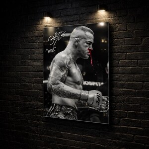 May include: Black and white print of a mixed martial arts fighter with a bloody nose. The fighter is wearing gloves and shorts, and has tattoos on his arms. The word "WAR" is written above the fighter's head.
