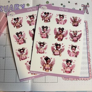May include: Two sticker sheets featuring illustrations of a woman with angel wings, sunglasses, and a bubblegum bubble. The stickers are in shades of pink and white, with heart accents. The text "Girly Pop" and "DaniHoneycutt.com" are visible.