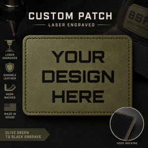 May include: Olive green custom patch with the text "YOUR DESIGN HERE" laser engraved in black. The patch is made of durable leather and has a hook backing. The image also shows the text "CUSTOM PATCH" and "LASER ENGRAVED".
