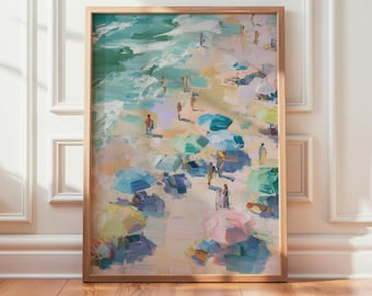 May include: A framed wall art print featuring an impressionistic painting of a crowded beach scene. The artwork displays numerous colorful umbrellas in shades of blue, green, pink, and yellow scattered across a sandy shore near the ocean waves.