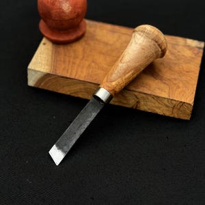 May include: A set of three ceramic mugs with a speckled, matte finish in cream, light grey, and dark grey. Each mug has a simple, minimalist design, suitable for coffee or tea.