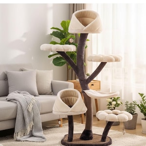 May include: A multi-level cat tree with a tree trunk design. It features beige, plush perches and hideaways, and a sisal-covered base. The tree has a neutral color palette, blending with the room's decor. Includes hanging toys for play.