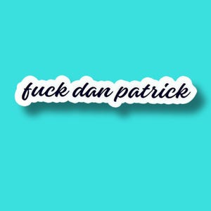 May include: A die-cut vinyl sticker featuring the text "fuck dan patrick" written in a dark blue, cursive script font. The lettering is outlined in a thick white border, creating a clean, high-contrast look against the solid turquoise background.