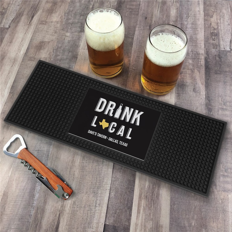 This bar mat can be personalized with your state and any text you want. It has a slotted surface to capture spilled drinks.