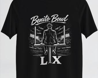 May include: Black t-shirt featuring a graphic of a person sitting on a goalpost, with the text "Benito Bowl" above and "LX" below. The design is in white, set against a stadium backdrop.