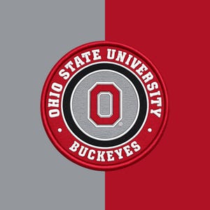 May include: A circular embroidered patch featuring the Ohio State University logo. The design includes a central red block letter O on a grey background, surrounded by a black ring and a red outer border with the white text Ohio State University Buckeyes.