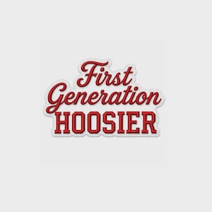 May include: A red embroidered patch featuring the text First Generation in a cursive script font above the word HOOSIER in a bold, block, serif capital letter font. The design has a white border that follows the shape of the lettering.