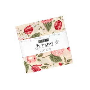 May include: A stack of square fabric pieces featuring a floral pattern with red tulips, pink hydrangeas, and green leaves on a cream background. A white paper band wraps around the center, printed with the text Je T'aime by Stacy Iest Hsu.