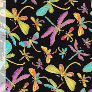 May include: A black fabric featuring a repeating pattern of dragonflies in vibrant shades of purple, blue, yellow, and orange. A ruler along the left and bottom edges shows the scale in inches, with the fabric width measuring 8 inches.