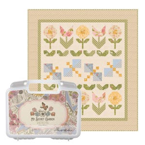 May include: A square quilt featuring a floral pattern with yellow, pink, and blue blocks on a cream background, bordered by a tan gingham frame. Beside it is a white plastic carrying case labeled My Secret Garden by Stacy Iest Hsu.