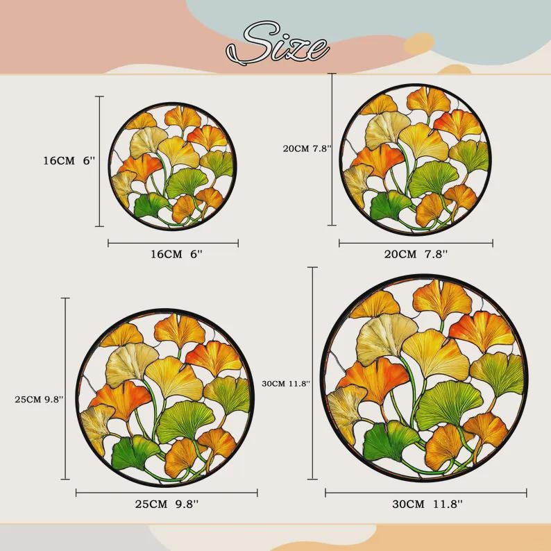 May include: Four circular metal wall art pieces featuring ginkgo leaf designs in yellow, orange, and green. The sizes are labelled as 16 cm, 20 cm, 25 cm, and 30 cm in diameter, with corresponding imperial measurements also provided.