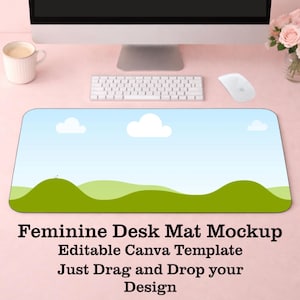 May include: A rectangular desk mat with a landscape design featuring a blue sky with white clouds and green rolling hills. The mat has the text "Feminine Desk Mat Mockup Editable Canva Template Just Drag and Drop your Design".