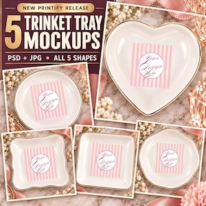 May include: Five white ceramic trinket trays in heart, round, square, and scalloped shapes with gold rims. Each tray features a pink vertical striped pattern and a central circular graphic with the text Your Design Here in script font.