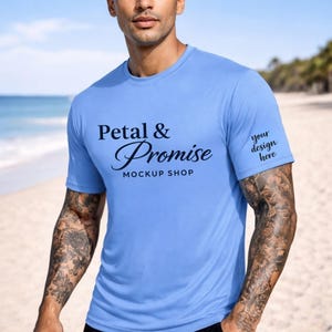 May include: A light blue crew neck t-shirt with the text "Petal & Promise MOCKUP SHOP" on the front. The sleeve has the text "your design here". The shirt is made of a soft, comfortable material.