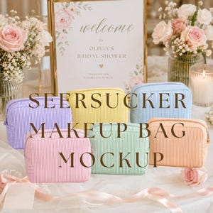 May include: A mockup of six seersucker makeup bags in pastel colors: lavender, yellow, light blue, peach, pink, and mint green. The bags are arranged on a white surface with a sign that reads "welcome to Olivia's Bridal Shower".