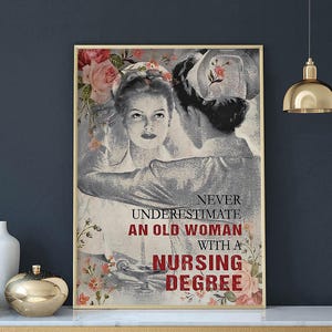 May include: A framed print featuring a vintage-style image of two nurses, with floral accents. The text reads "Never Underestimate an Old Woman with a Nursing Degree" in a bold, red font.