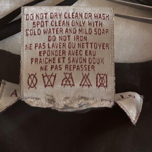Vintage beaded jacket care label.