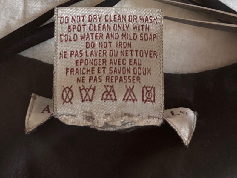 Vintage beaded jacket care label.