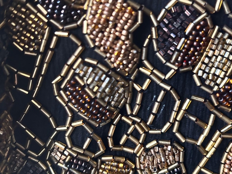 Luxury vintage evening wrap with intricate glass beading.