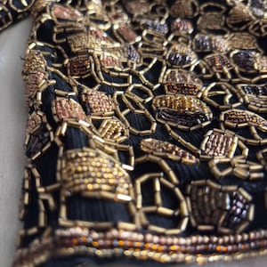 Hand-beaded Adrianna Papell silk bolero with metallic finish detail