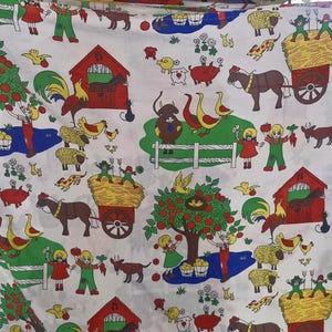 May include: A white fabric featuring a repeating farmyard pattern. The design includes red barns, green apple trees, farm animals, and children. The colour scheme is bright and cheerful, with accents of yellow, blue, and brown.