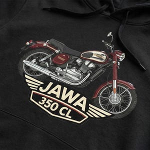 May include: Black hoodie featuring a detailed illustration of a vintage Jawa 350 CL motorcycle in maroon and silver. The motorcycle graphic is set against a white winged emblem with the text "JAWA 350 CL".