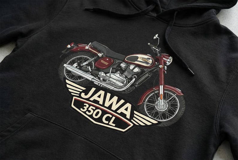 May include: Black hoodie featuring a detailed illustration of a vintage Jawa 350 CL motorcycle in maroon and silver. The motorcycle graphic is set against a white winged emblem with the text "JAWA 350 CL".