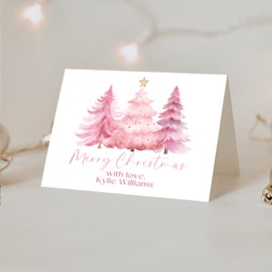 a card with a watercolor christmas tree on it