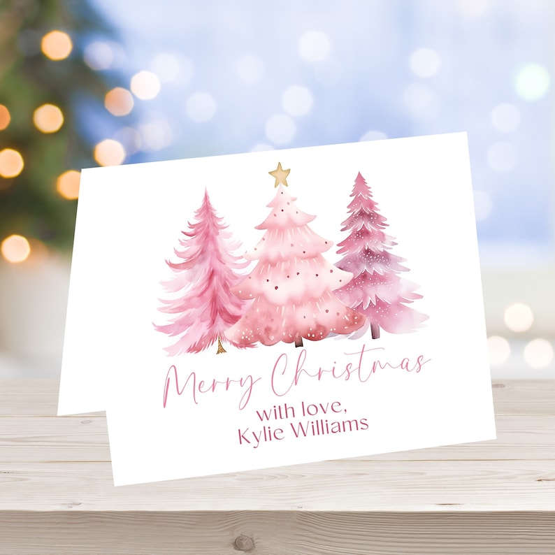a card with a watercolor christmas tree on it