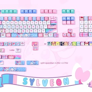 May include: A custom mechanical keyboard keycap set in pastel pink, blue, and white. The keycaps feature various designs, including a Sylveon theme, with the word "SYLVEON" in the bottom banner. The keycaps are designed for a split spacebar.