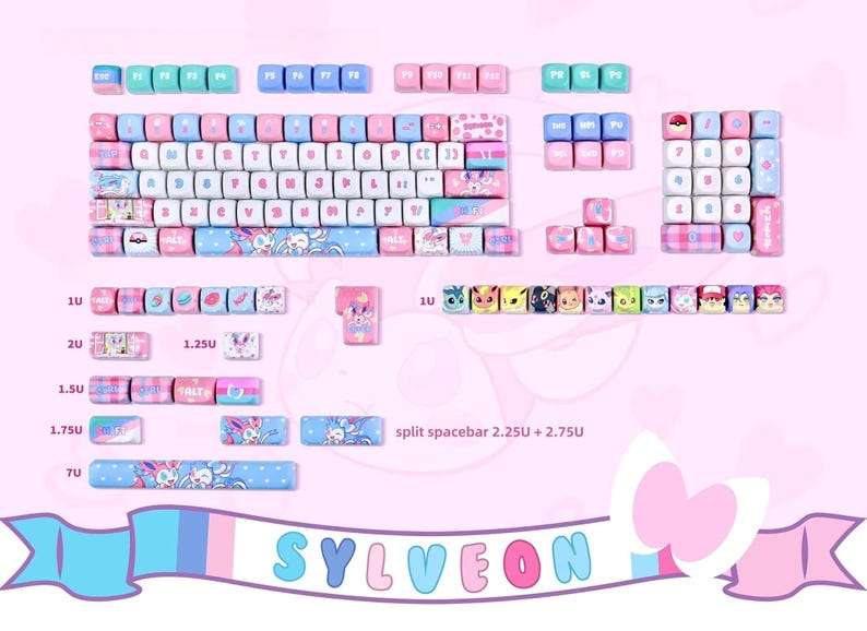 May include: A custom mechanical keyboard keycap set in pastel pink, blue, and white. The keycaps feature various designs, including a Sylveon theme, with the word "SYLVEON" in the bottom banner. The keycaps are designed for a split spacebar.