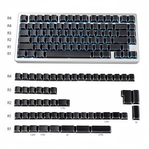 May include: A silver mechanical keyboard with black keycaps and blue backlighting. The image also shows additional keycaps in various sizes, including 1.25U, 1.75U, 2U, and 2.75U. The keyboard has a compact design.