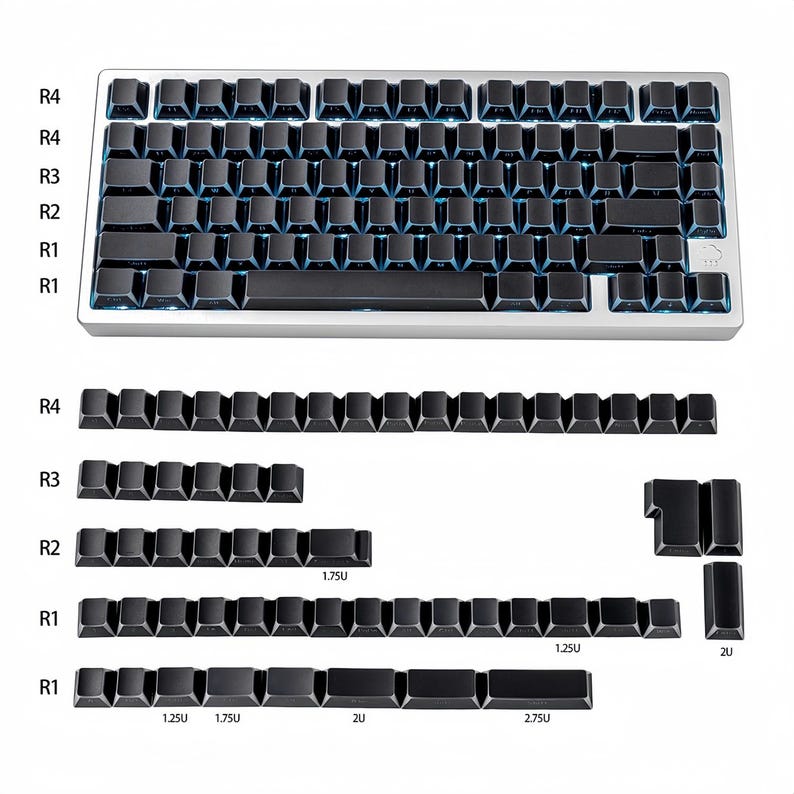 May include: A silver mechanical keyboard with black keycaps and blue backlighting. The image also shows additional keycaps in various sizes, including 1.25U, 1.75U, 2U, and 2.75U. The keyboard has a compact design.