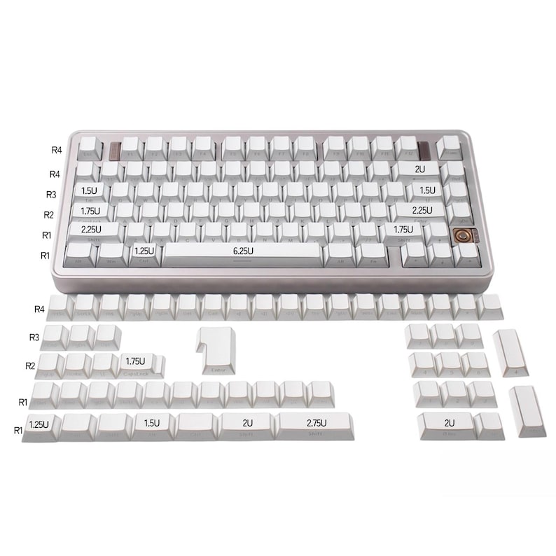 May include: A mechanical keyboard with white keycaps and a silver frame. The keyboard has a standard layout with various key sizes, including 1.25U, 1.5U, 1.75U, 2U, 2.25U, 2.75U, and 6.25U. Additional keycaps are displayed below the keyboard.