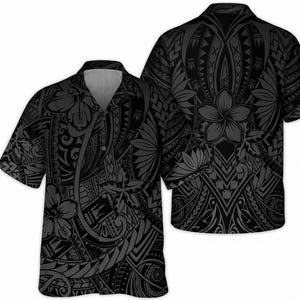 May include: A short-sleeved button-down shirt in black and dark gray featuring an intricate, repeating tribal-inspired pattern. The design incorporates stylized floral motifs, including plumeria blossoms, integrated into complex geometric shapes.