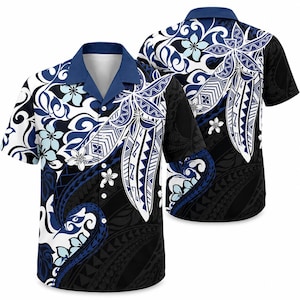 May include: A short-sleeved button-down shirt featuring a dark blue collar and a complex pattern of white, light blue, and black tribal-inspired motifs mixed with floral elements. The design includes geometric shapes and swirling lines throughout.