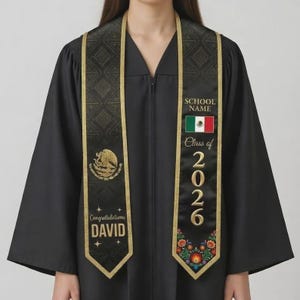 May include: Black graduation sash with gold trim and Mexican flag. The sash has the text "SCHOOL NAME", "Class of 2026", and "Congratulations DAVID". The sash is decorated with floral and geometric patterns.