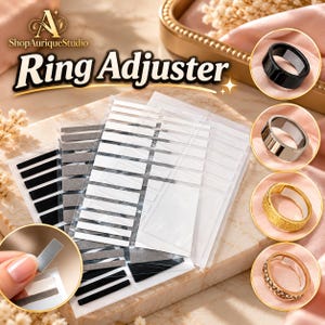 May include: A set of adhesive ring adjusters in black, gray, and clear strips on transparent backing sheets. The product is labeled Ring Adjuster and includes circular insets showing the strips applied to black, silver, gold, and diamond-encrusted rings.